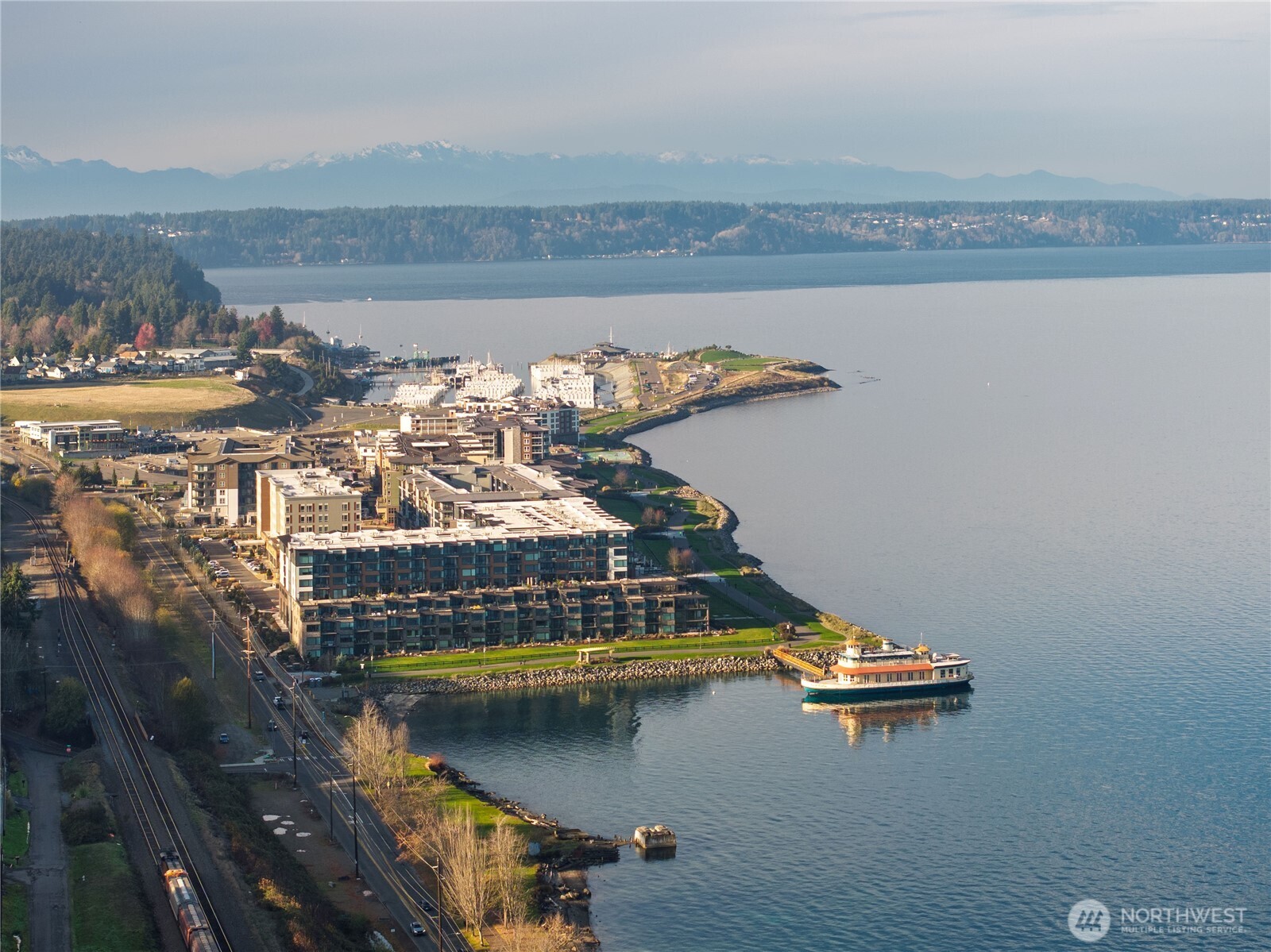 4907 Main Street, Unit 702 Tacoma, WA 98407 - Photo 1 of 33 a view of a lake with a nearby beach