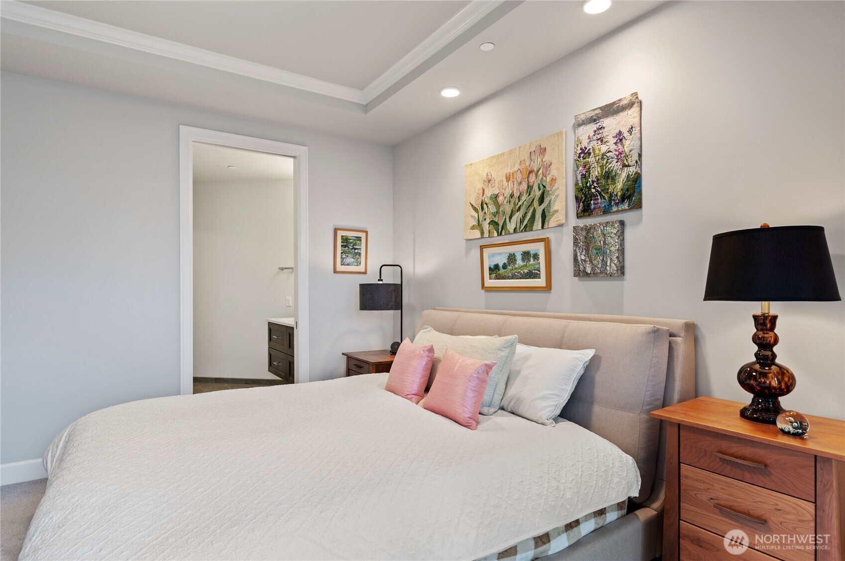 4907 Main Street, Unit 702 Tacoma, WA 98407 - Photo 13 of 33 a bedroom with a bed and a lamp on dresser