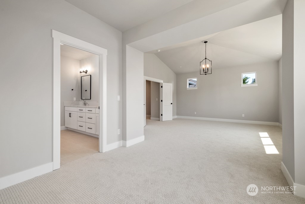 8713 Northeast 204th Street Bothell, WA 98011 - Photo 23 of 25 wooden floor and windows in a room