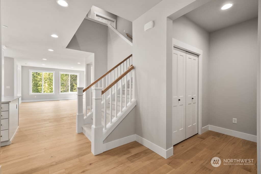 8713 Northeast 204th Street Bothell, WA 98011 - Photo 6 of 25 a view of entryway with stairs and wooden floor