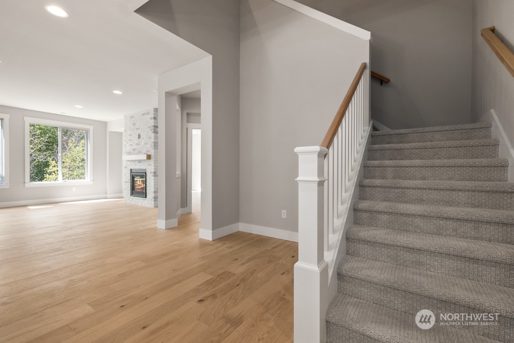 8713 Northeast 204th Street Bothell, WA 98011 - Photo 7 of 25 a view of an entryway with wooden floor and door