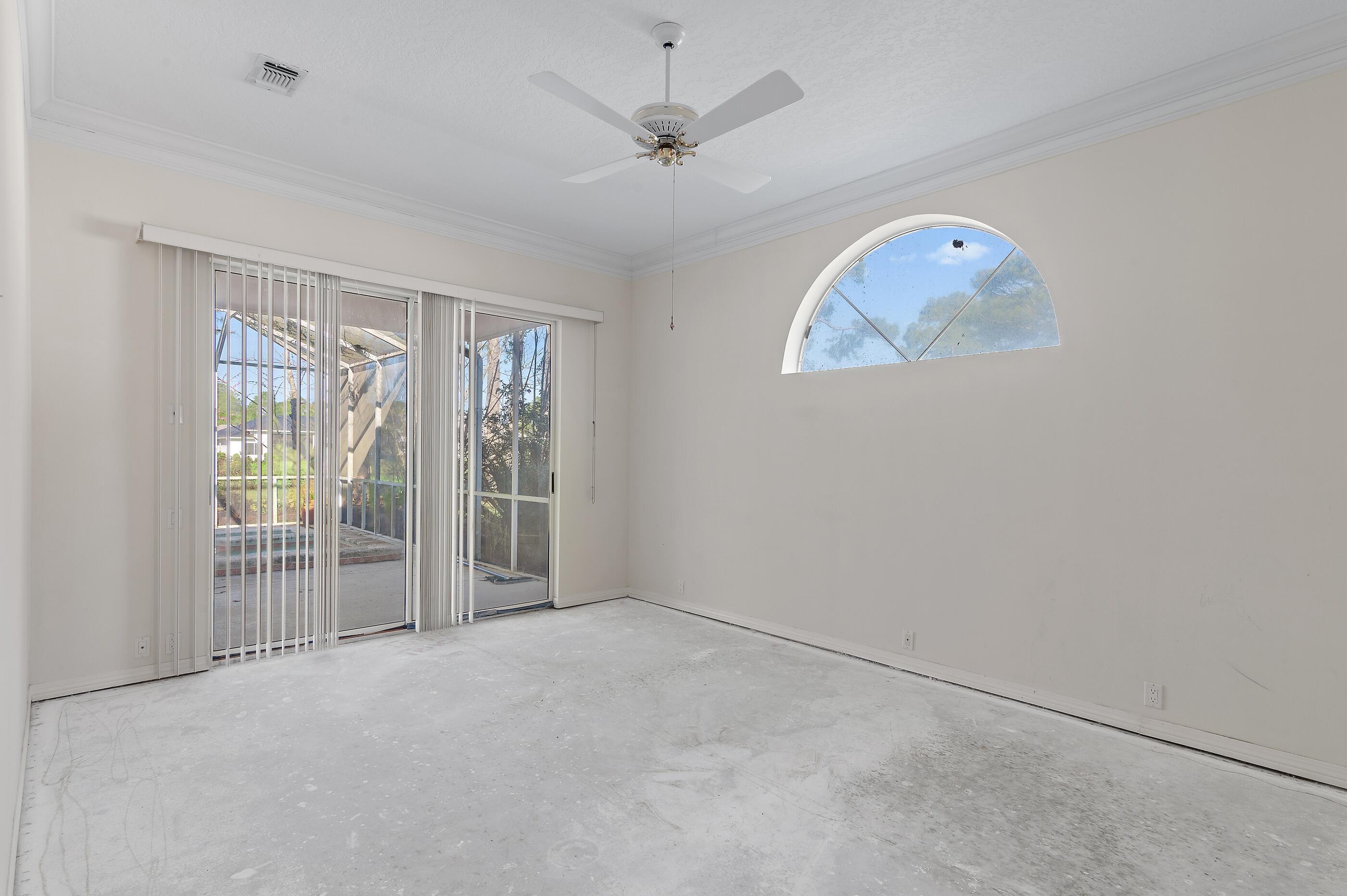 115 Garnet Place Destin, FL 32541 - Photo 19 of 21 an empty room with windows and closet
