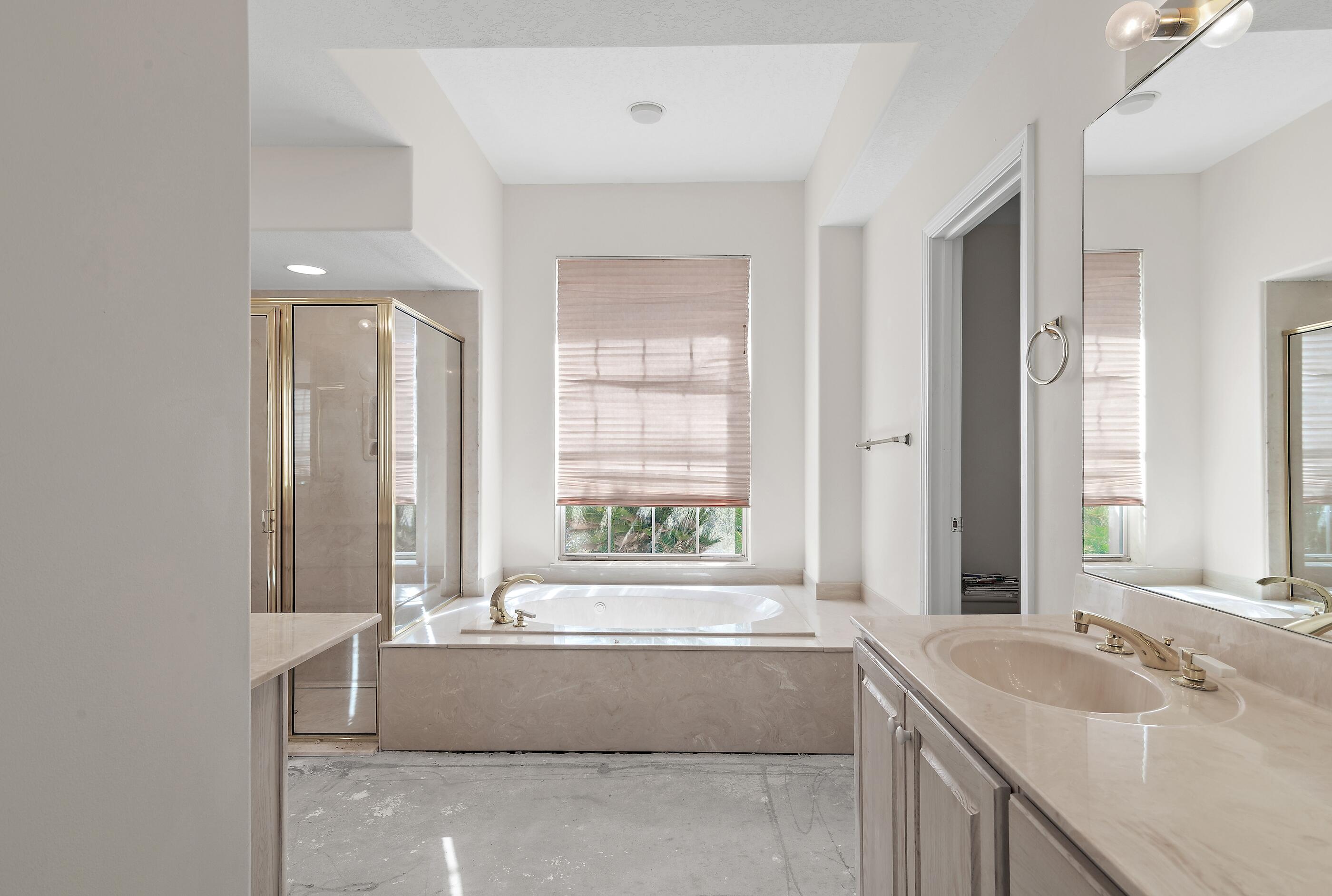 115 Garnet Place Destin, FL 32541 - Photo 20 of 21 a bathroom with bathtub and window