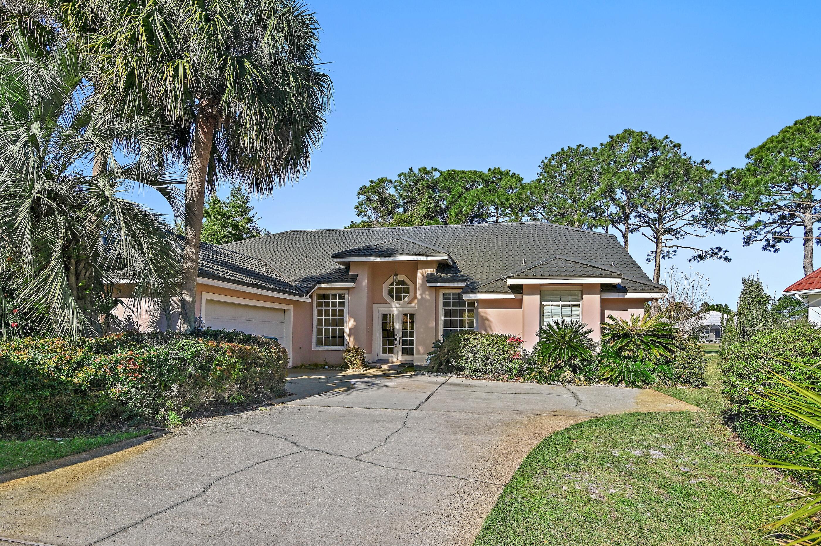 115 Garnet Place Destin, FL 32541 - Photo 2 of 21 front view of a house with a yard