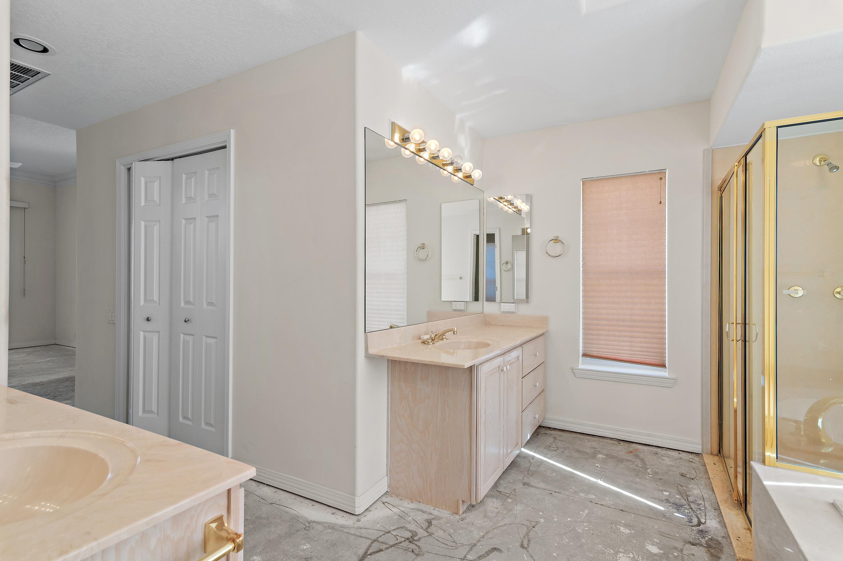 115 Garnet Place Destin, FL 32541 - Photo 21 of 21 a bathroom with a sink a mirror and a shower