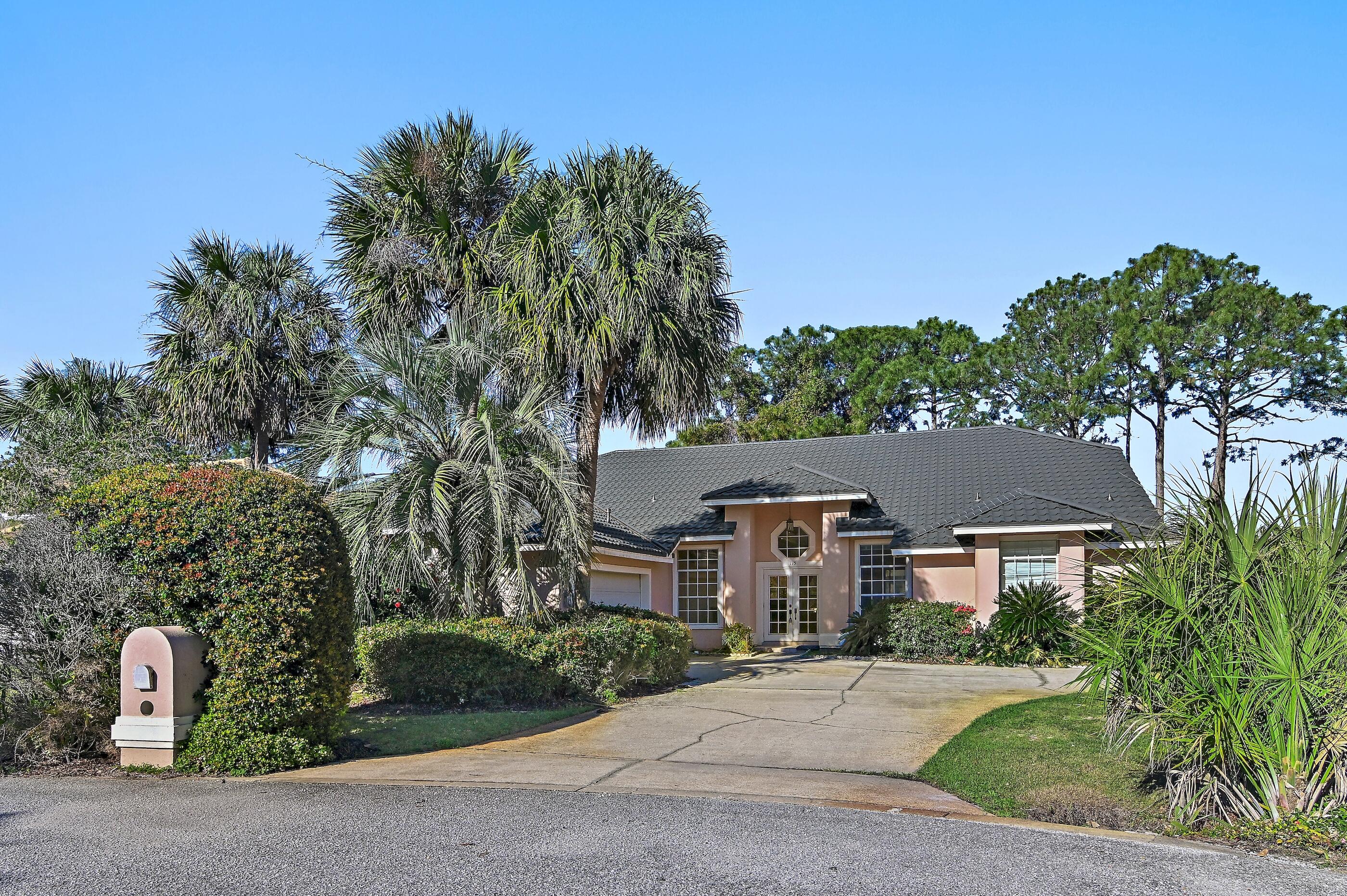 115 Garnet Place Destin, FL 32541 - Photo 3 of 21 front view of house with a yard