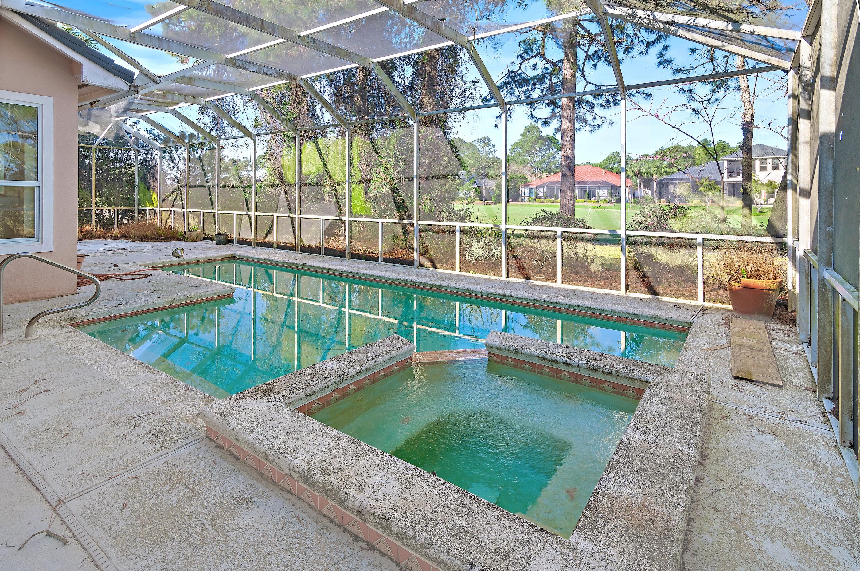 115 Garnet Place Destin, FL 32541 - Photo 8 of 21 a view of a swimming pool with a patio