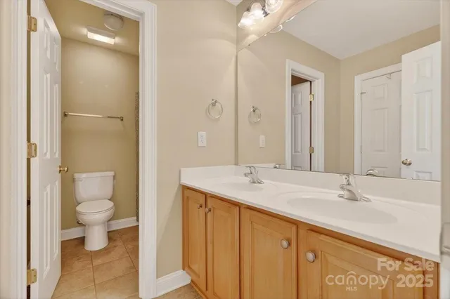 a white toilet sitting next to a shower