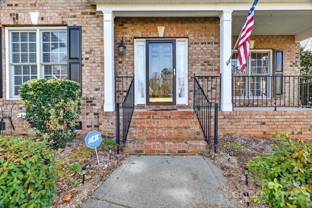 a front view of a house with a backyard