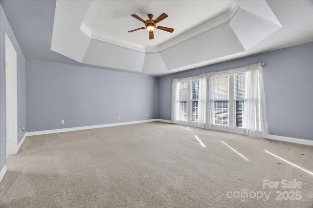 a spacious bathroom with a granite countertop sink and a mirror