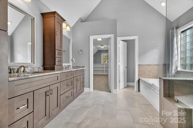 a bathroom with a shower and a sink