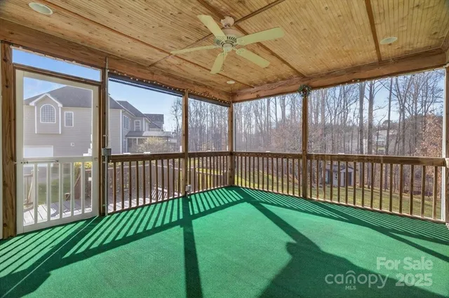 a view of a balcony with wooden floor