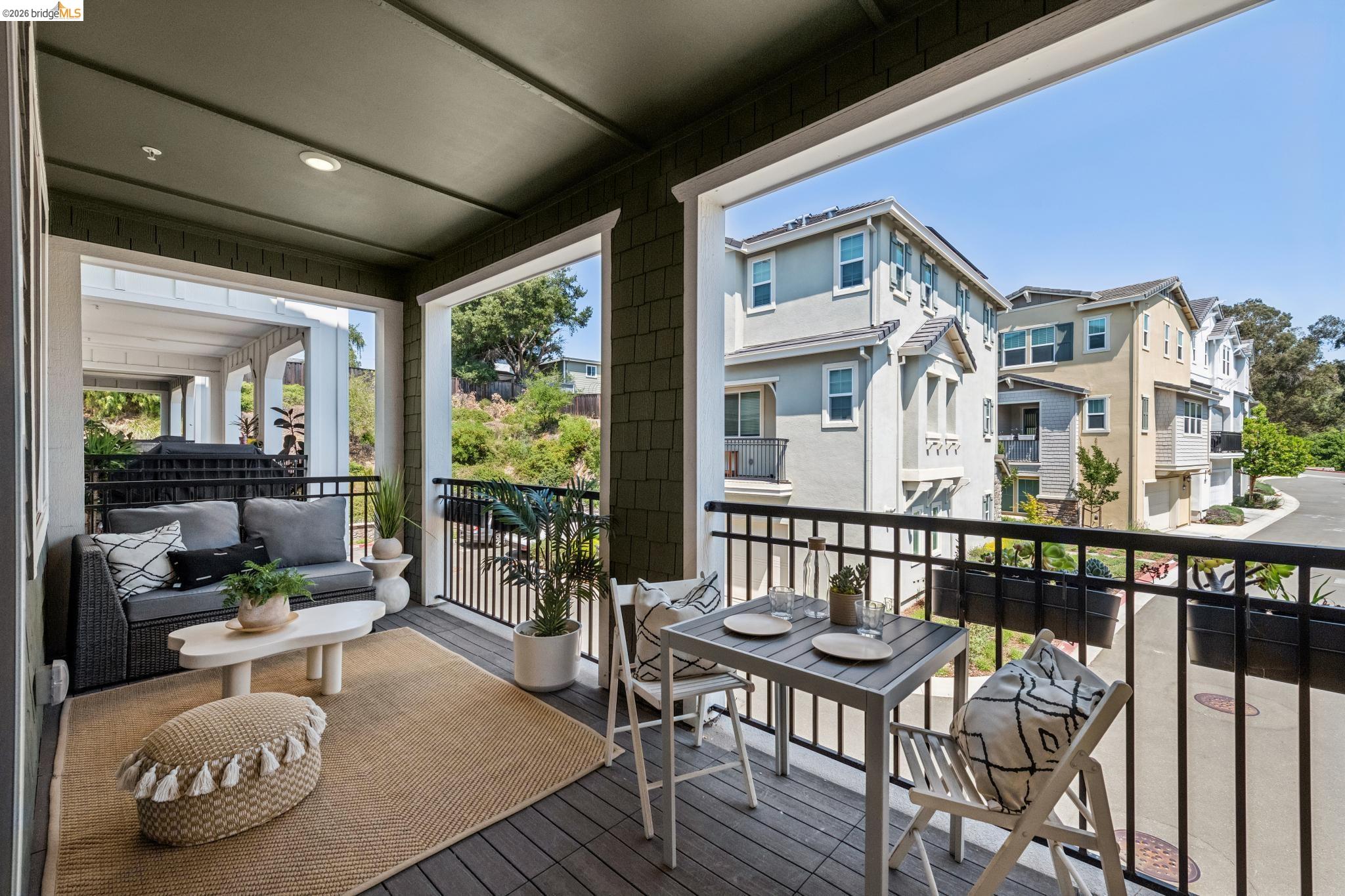 24157 Amaranth Loop Hayward, CA 94541 - Photo 49 of 63 Covered private balcony featuring wood-finish flooring, recessed lighting, and a black metal railing