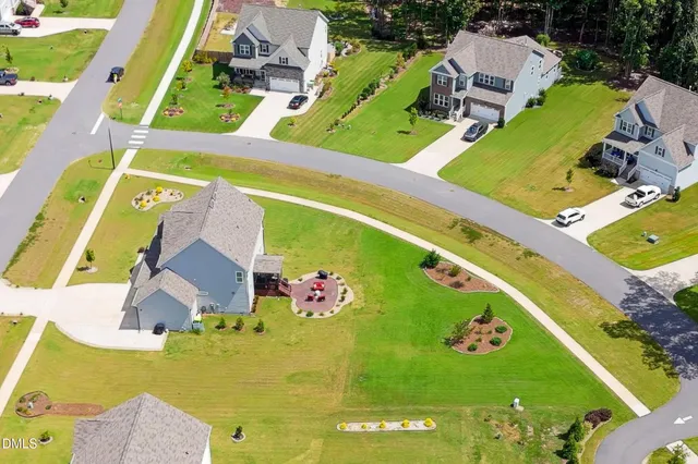 an aerial view of a pool patio kitchen and outdoor seating