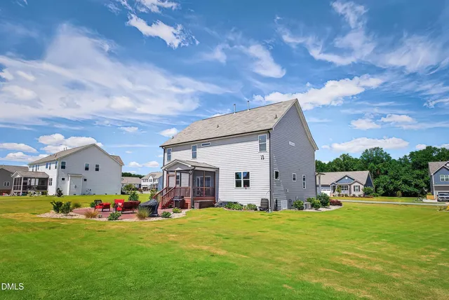 a front view of house with yard and entertaining space