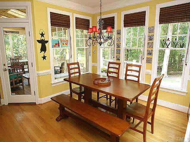 9113 Reedham Oaks Court Raleigh, NC 27615 - Photo 5 of 10 This is a large b-fast area overlooking your multi tiered deck, water features and huge backyard. Walk right out to fabulous screened porch with vaulted bead board ceiling, fans, and big skylights. Incredible!