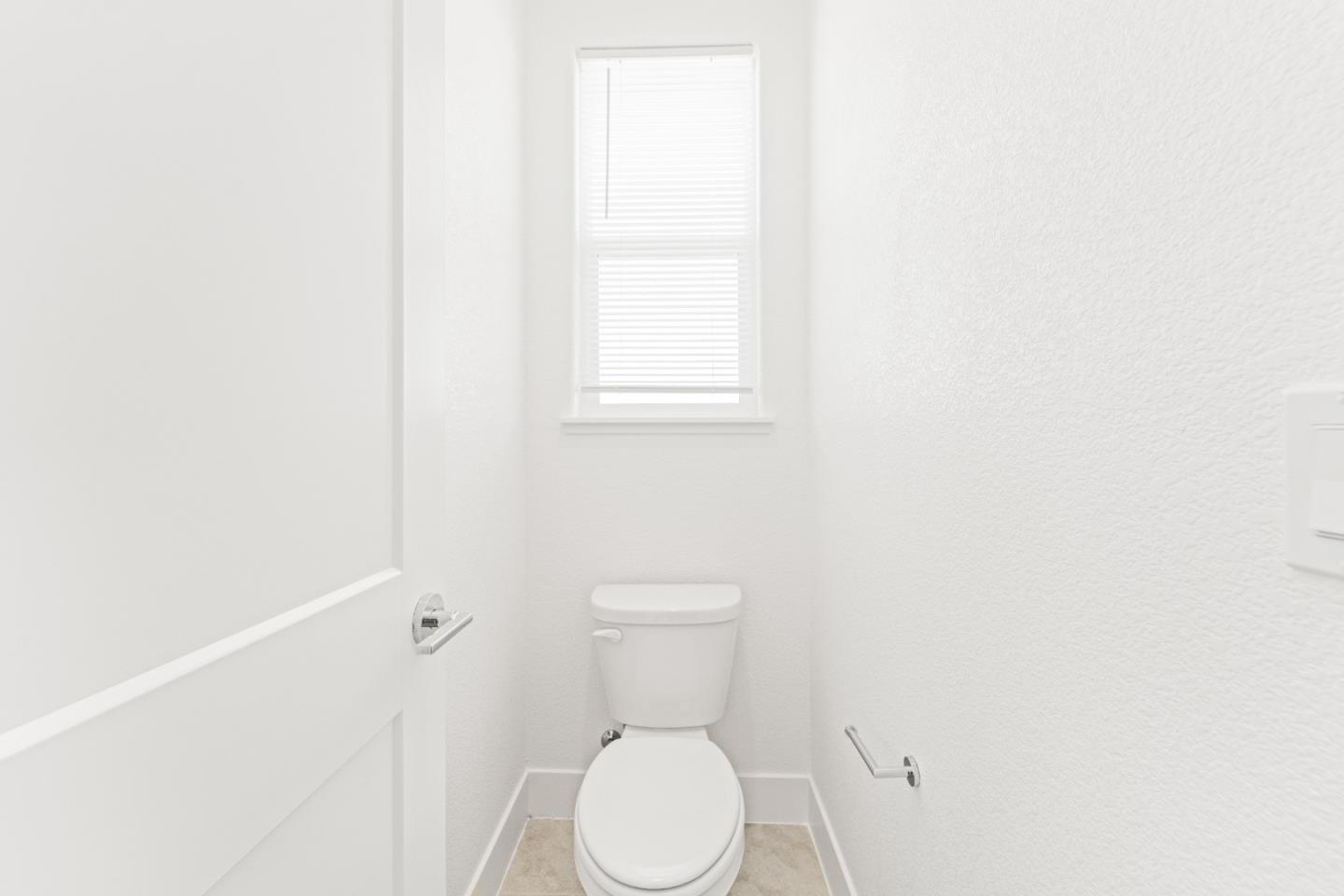 384 Ramos Ranch Road Oakley, CA 94561 - Photo 23 of 39 a white toilet sitting in a bathroom next to a window