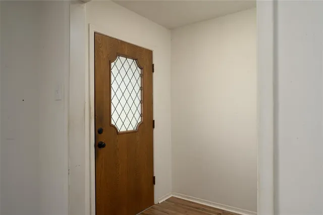 a view of entryway with wooden floor