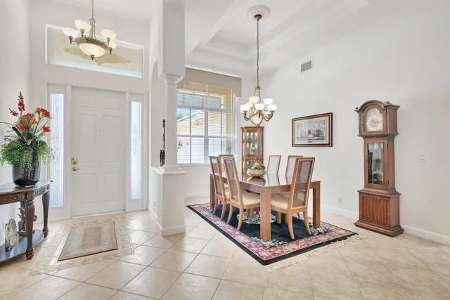 a living room with lots of furniture and a large window
