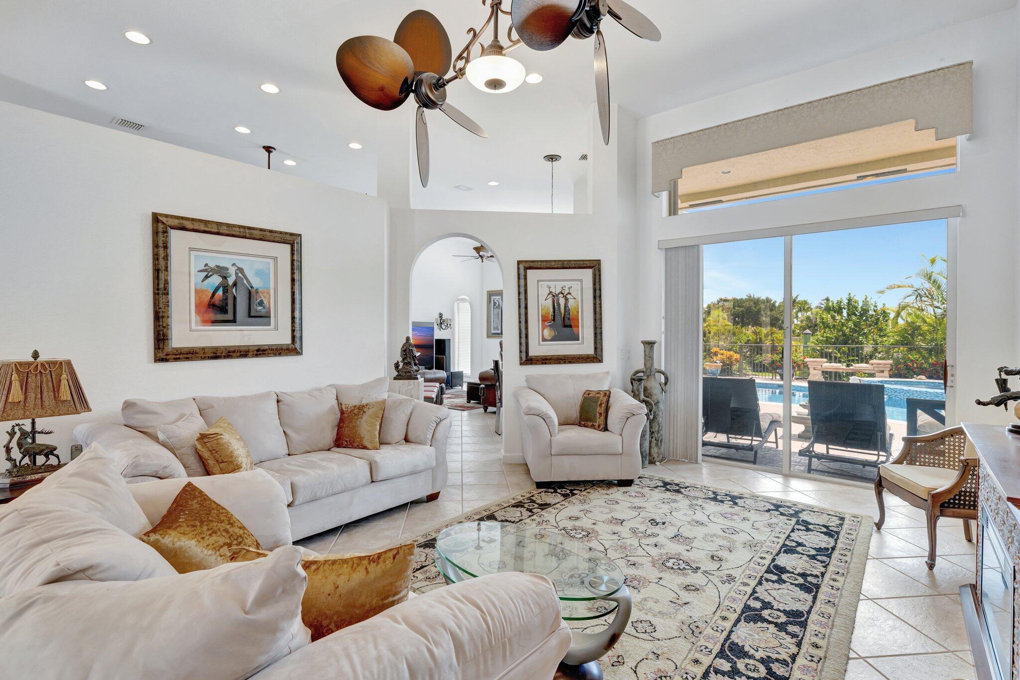 699 Southwest River Bend Circle Stuart, FL 34997 - Photo 15 of 78 a living room with furniture and a large window