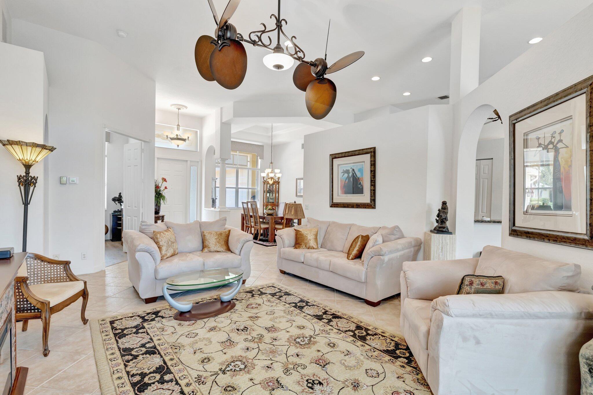 699 Southwest River Bend Circle Stuart, FL 34997 - Photo 16 of 78 a living room with lots of furniture and a large window