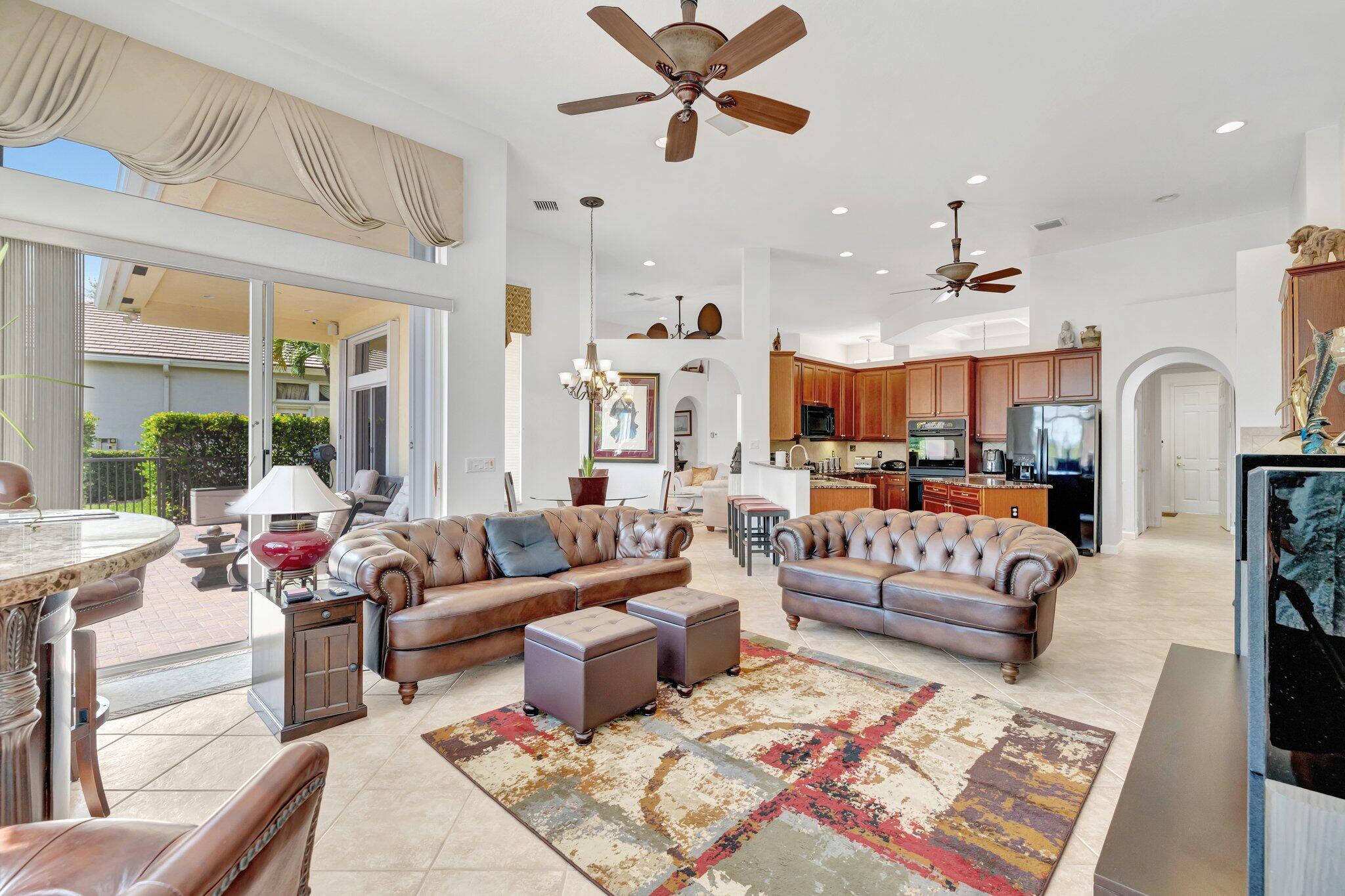 699 Southwest River Bend Circle Stuart, FL 34997 - Photo 21 of 78 a living room with furniture kitchen view and a large window