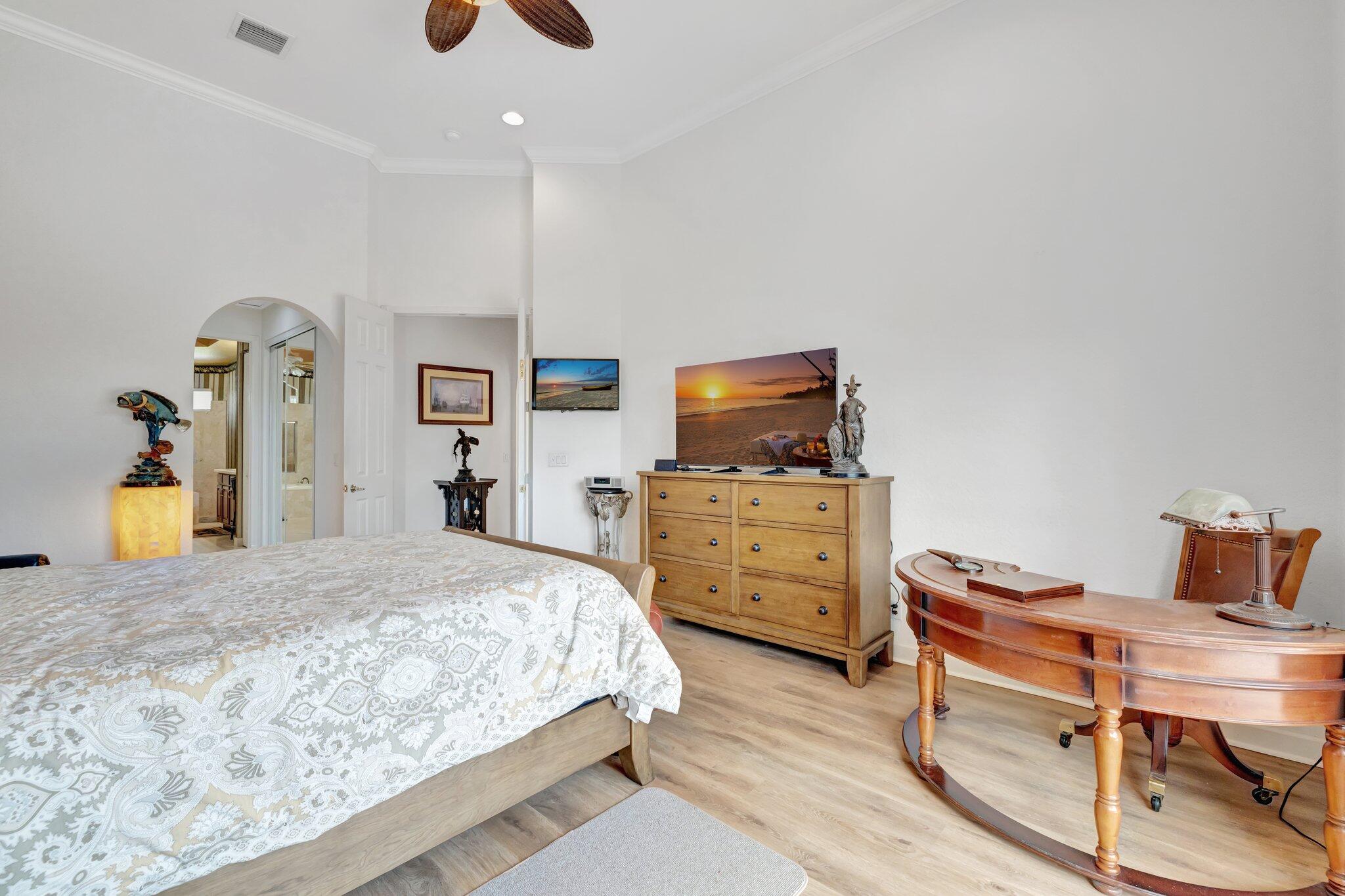 699 Southwest River Bend Circle Stuart, FL 34997 - Photo 24 of 78 a bedroom with furniture and a flat screen tv