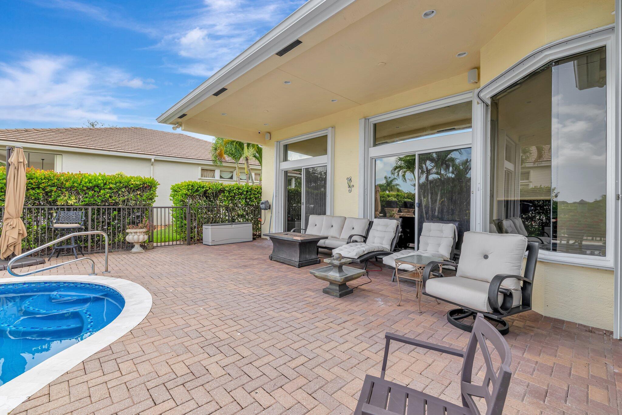 699 Southwest River Bend Circle Stuart, FL 34997 - Photo 30 of 78 a building outdoor space with patio furniture and potted plants