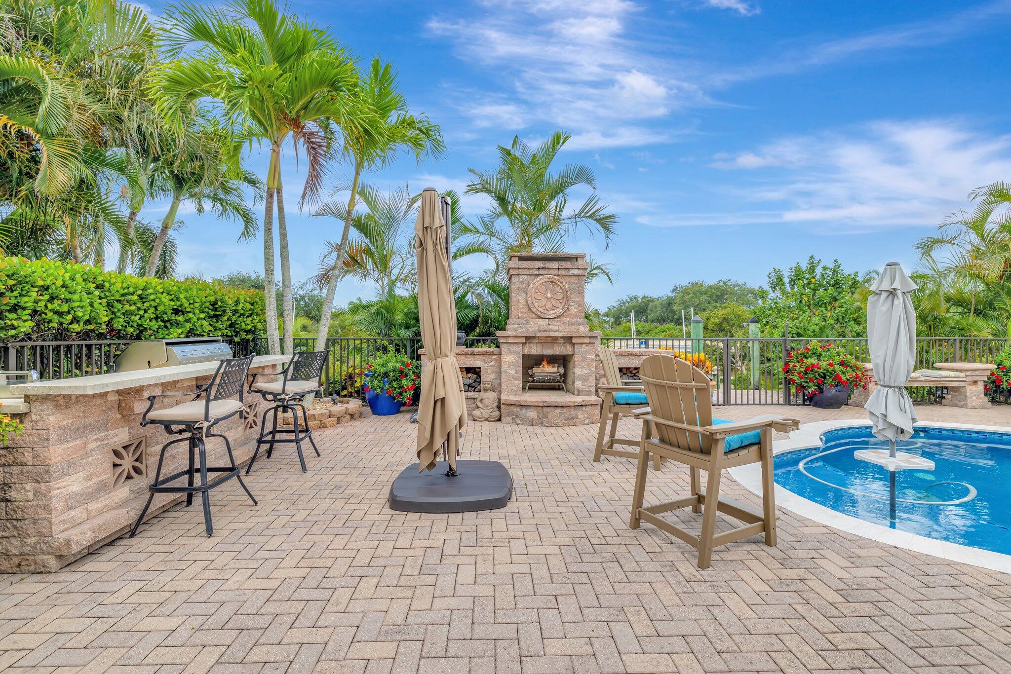 699 Southwest River Bend Circle Stuart, FL 34997 - Photo 3 of 78 Patio/fireplace/pool /kichen/bar