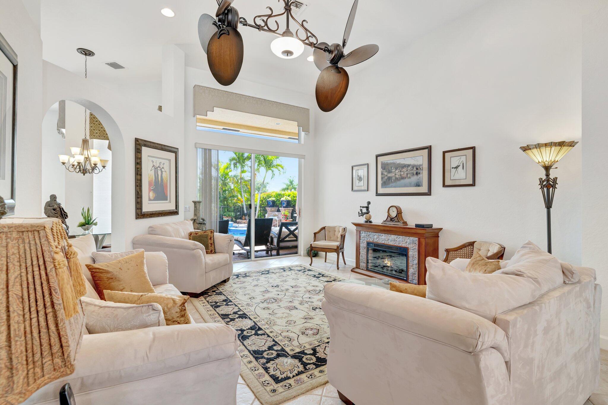 699 Southwest River Bend Circle Stuart, FL 34997 - Photo 33 of 78 a living room with furniture and a fireplace