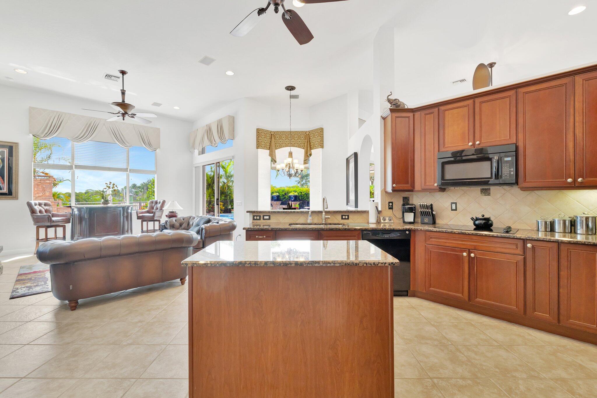 699 Southwest River Bend Circle Stuart, FL 34997 - Photo 35 of 78 a large kitchen with cabinets