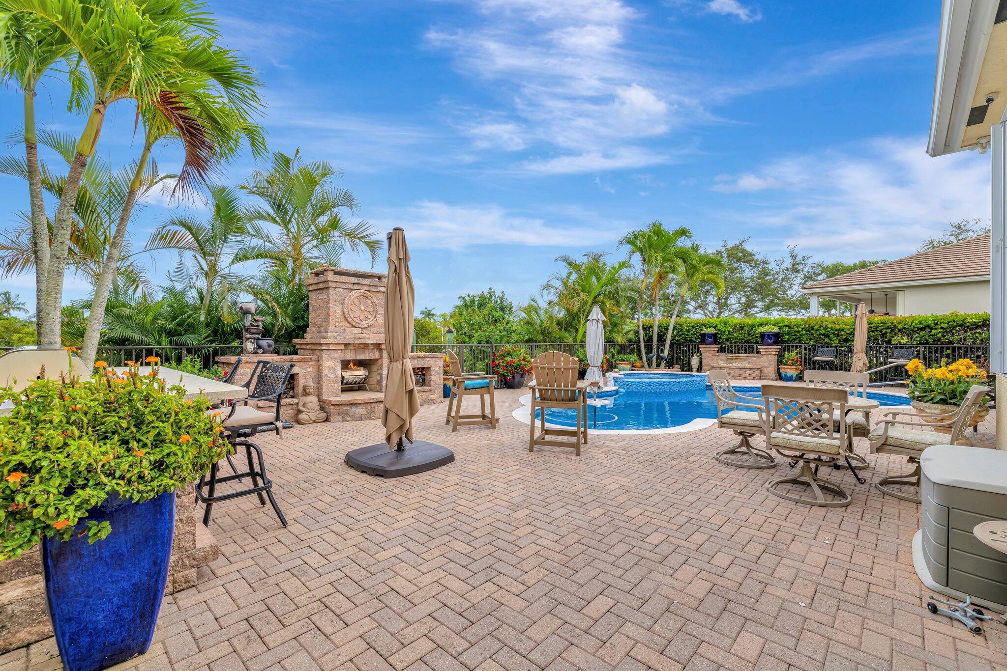 699 Southwest River Bend Circle Stuart, FL 34997 - Photo 4 of 78 Patio/fireplace/pool /kichen/bar