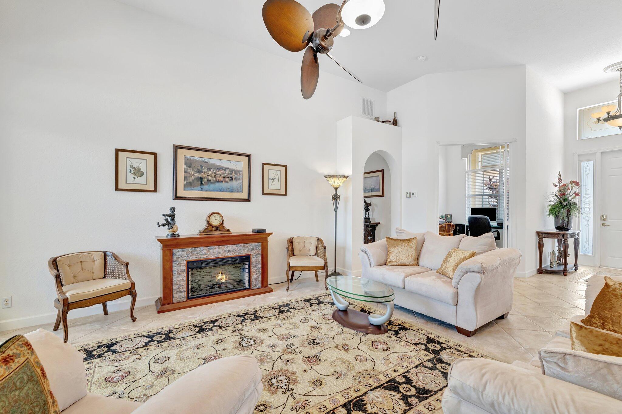 699 Southwest River Bend Circle Stuart, FL 34997 - Photo 41 of 78 a living room with furniture and a fireplace