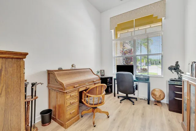 an aerial view of a houses with a yard