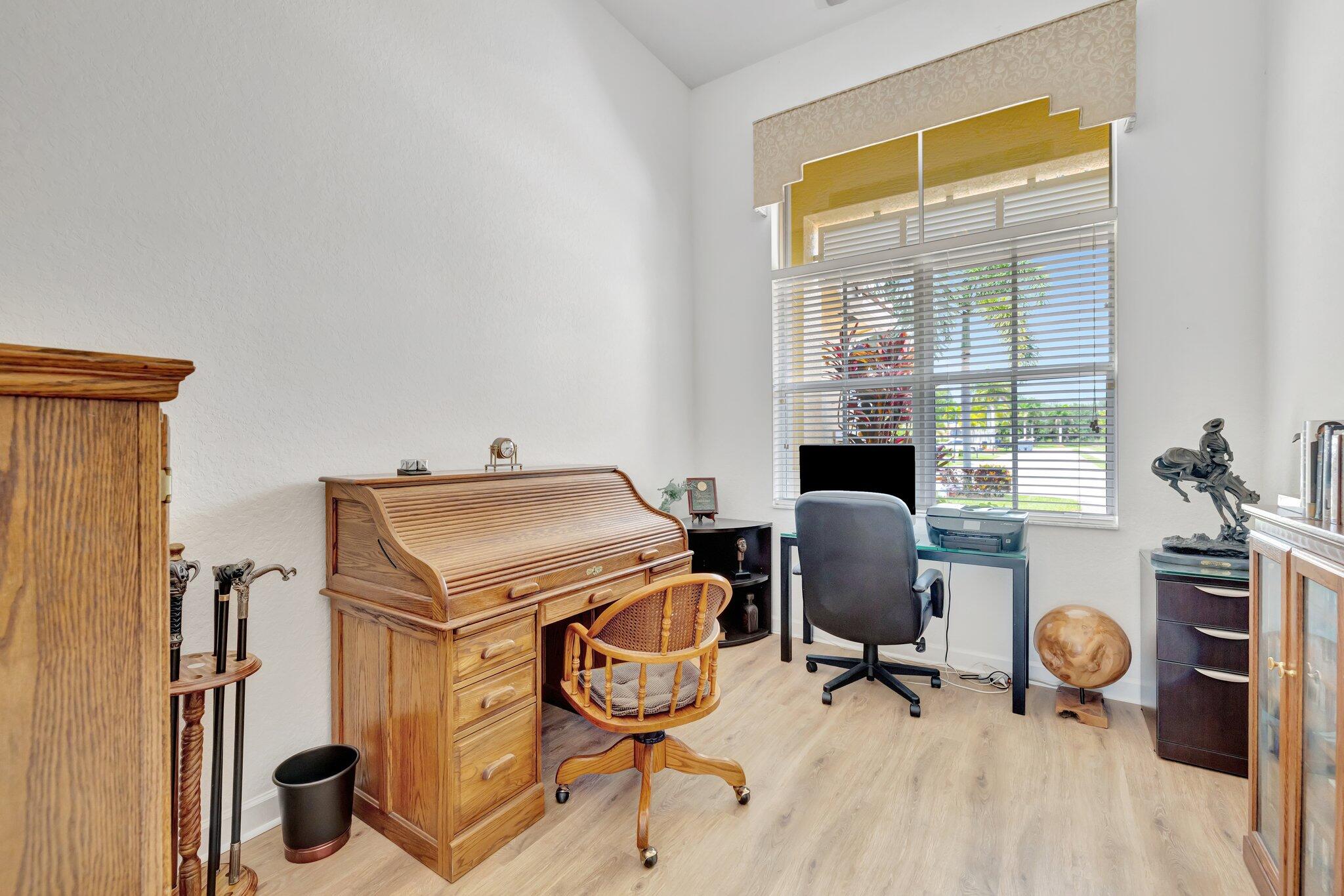 699 Southwest River Bend Circle Stuart, FL 34997 - Photo 42 of 78 a view of a workspace with furniture and a window