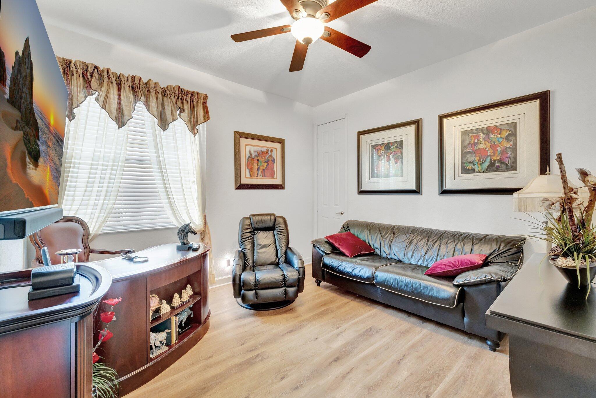 699 Southwest River Bend Circle Stuart, FL 34997 - Photo 49 of 78 a living room with furniture and a window