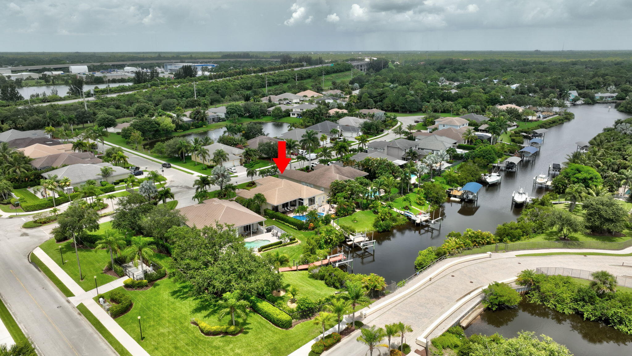 699 Southwest River Bend Circle Stuart, FL 34997 - Photo 68 of 78 an aerial view of residential houses with outdoor space and trees