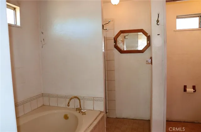 an empty room with a bathroom