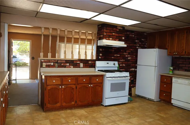 a kitchen with a stove and a refrigerator