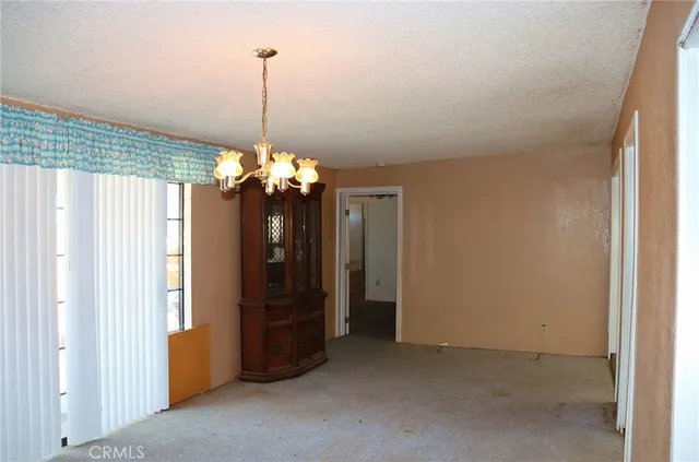 a bedroom with a bed and a table