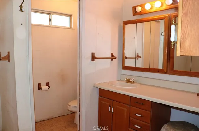 a kitchen with appliances a sink and cabinets