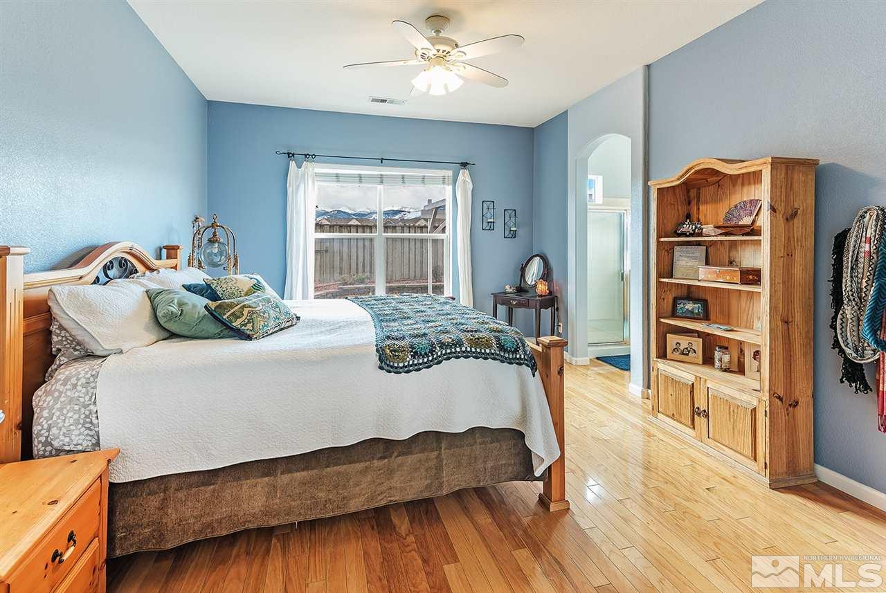 10535 Arbor Way Reno, NV 89521 - Photo 13 of 19 a bedroom with a bed and a book shelf