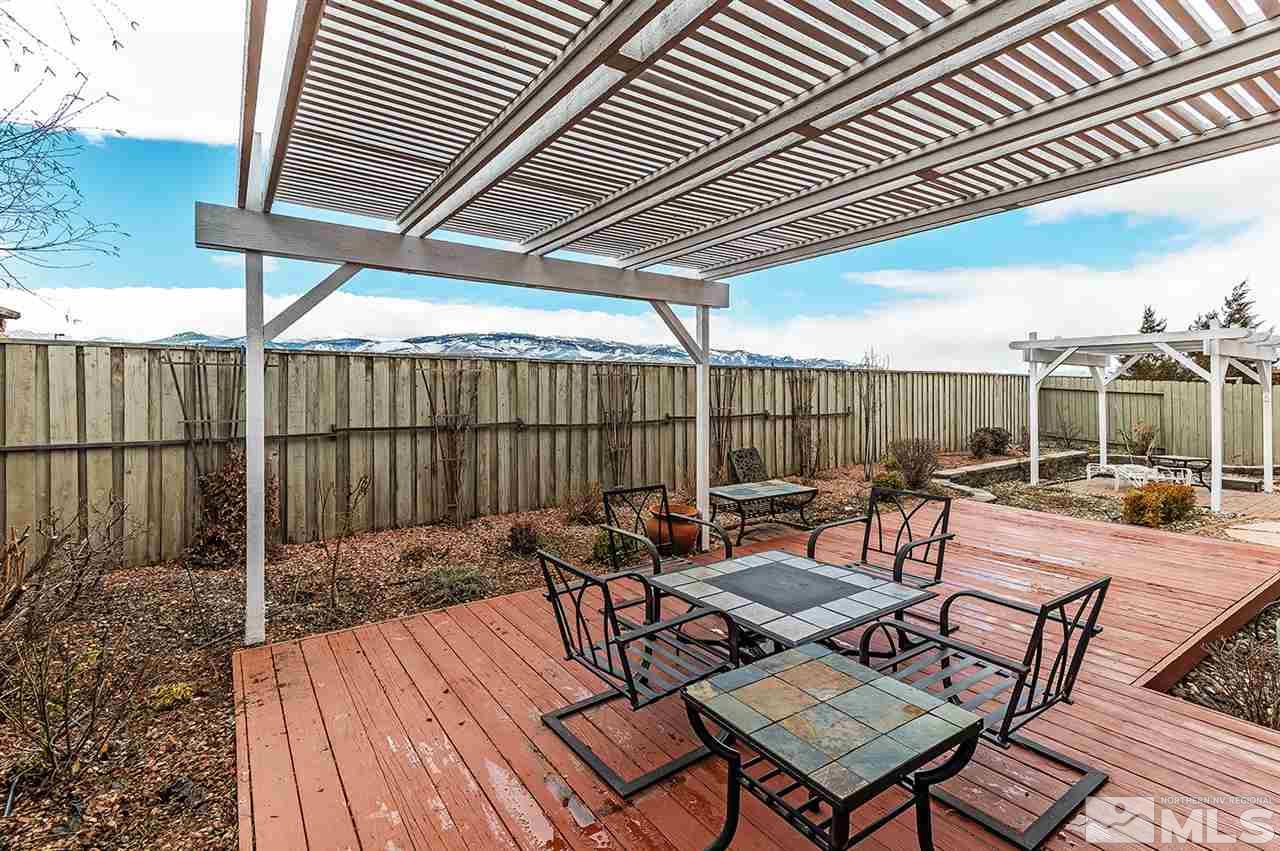 10535 Arbor Way Reno, NV 89521 - Photo 17 of 19 a view of a patio with a table and chairs