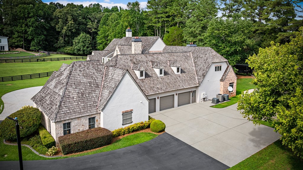 640 A J Land Road Canton, GA 30115 - Photo 13 of 94 a aerial view of a house with a yard table and chairs