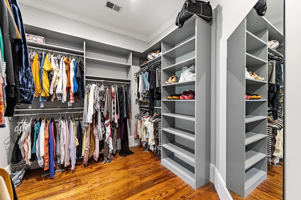 640 A J Land Road Canton, GA 30115 - Photo 32 of 94 a view of walk in closet with clothes and shoes