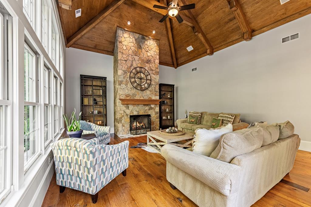 640 A J Land Road Canton, GA 30115 - Photo 35 of 94 a living room with furniture and a fireplace