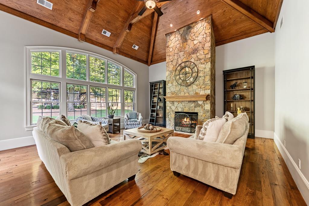 640 A J Land Road Canton, GA 30115 - Photo 36 of 94 a living room with furniture large window and fireplace