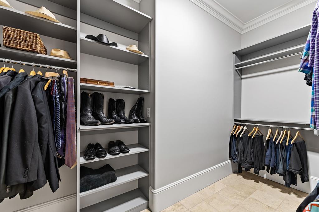 640 A J Land Road Canton, GA 30115 - Photo 40 of 94 a view of walk in closet with clothes and shoes