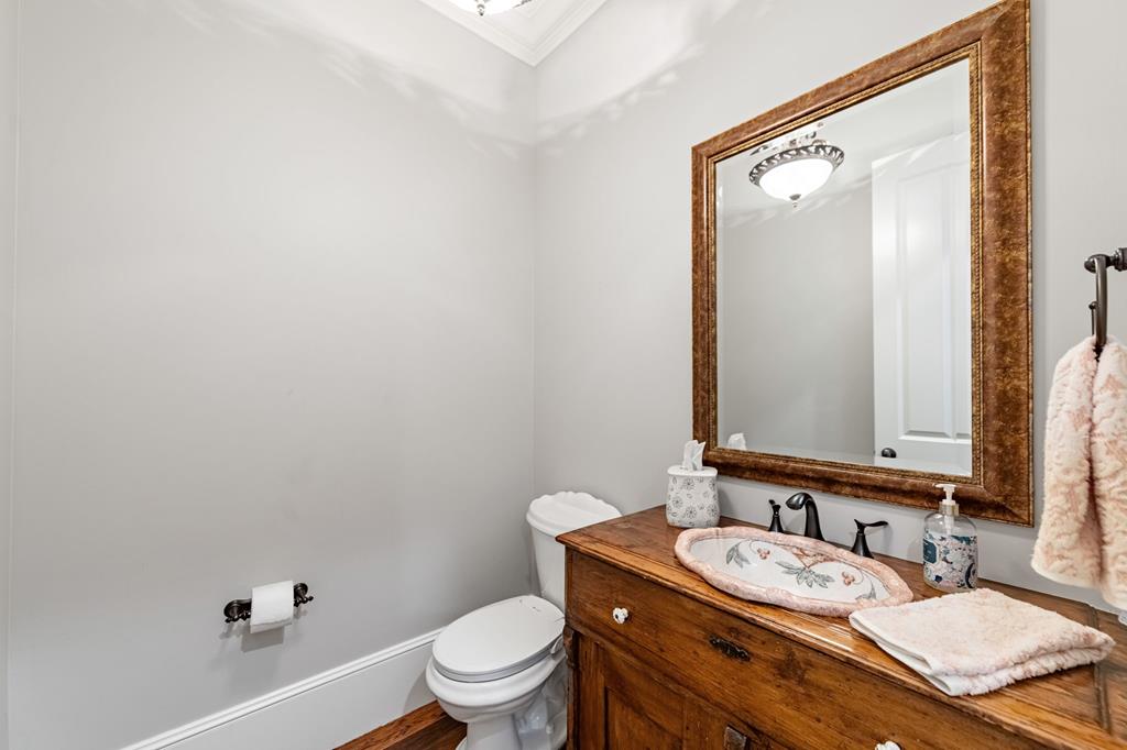 640 A J Land Road Canton, GA 30115 - Photo 50 of 94 a bathroom with a granite countertop sink mirror vanity and toilet