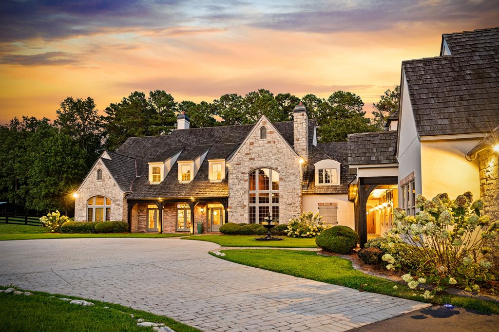 640 A J Land Road Canton, GA 30115 - Photo 5 of 94 a front view of a house with a yard and garage